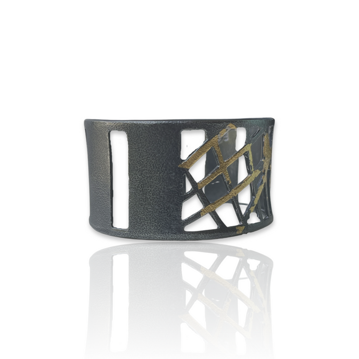 Cuff bracelet in oxidized Sterling Silver fused with 23K Gold