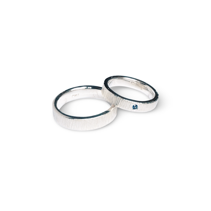His & Hers Wedding Bands in Sterling Silver with Blue Sapphire